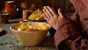 MONK EATING PRAYING