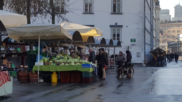 People buying sauerkraut on market in Ljubljana