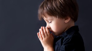 BOY PRAYING