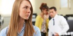 woman Being Gossiped About By Colleagues