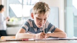 BOY DOING HOMEWORK