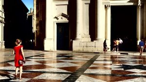 WOMAN IN FRONT OF THE CHURCH