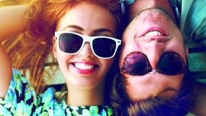 Happy couple portraits wearing sunglasses