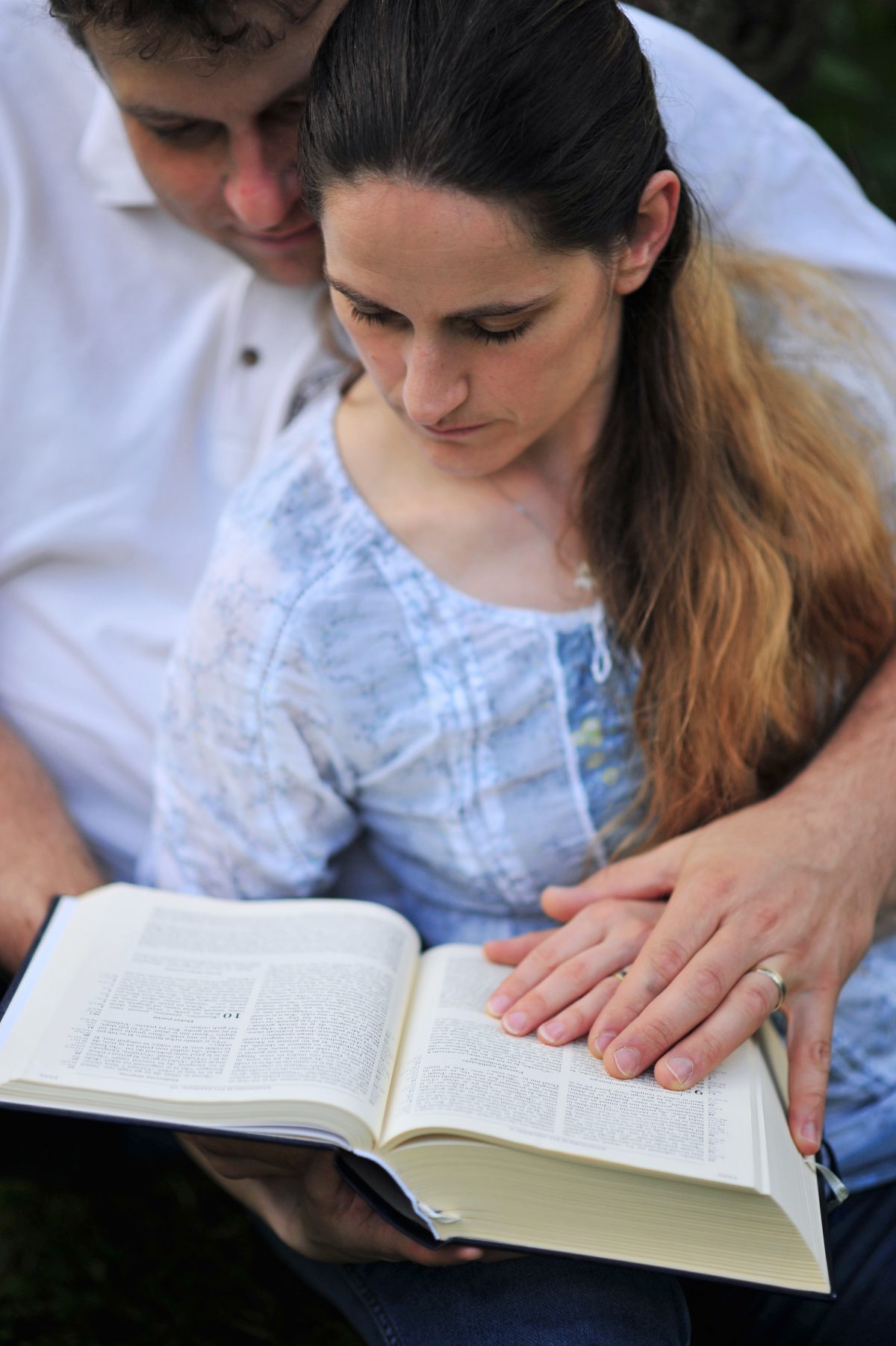 COUPLE READING BIBLE