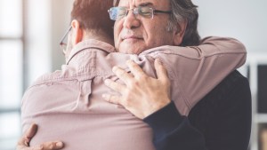 son hugs father