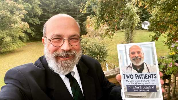 Dr.-John-Bruchalski-with-his-book-Two-Patients-My-Conversion-from-Abortion-to-Life-Affirming-Medicine-Ignatius-Press-Facebook