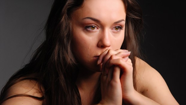 Sad woman praying