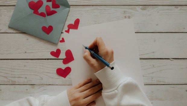 Envelope with red hearts