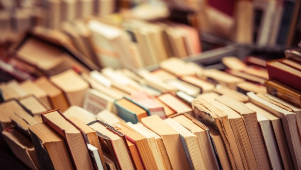 Many old books in a book shop or library