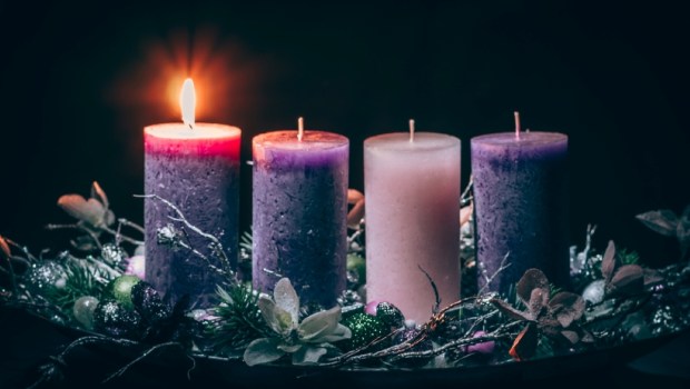 advent cristian concept with 1 pink candle and 3 purple candles