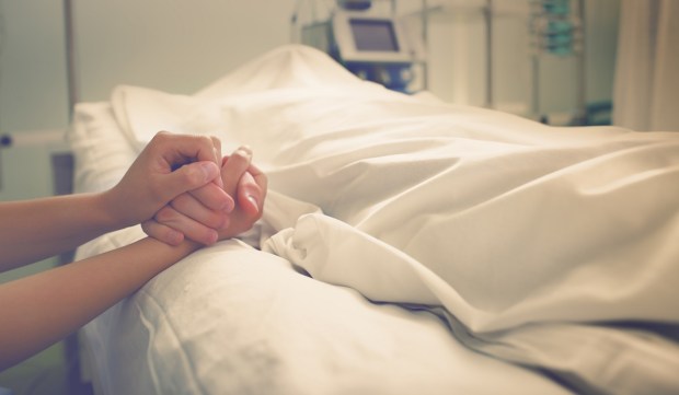 hands mourning dead loved one