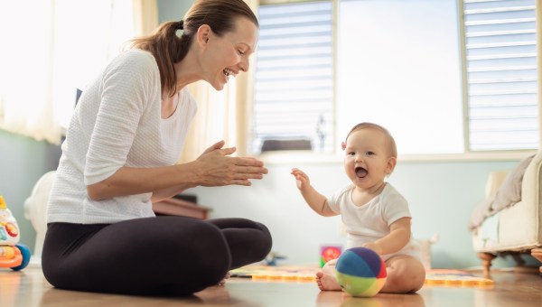 Happy mother and baby playtime at home