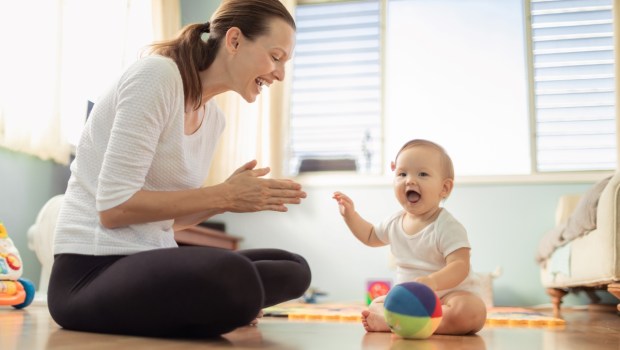 Happy mother and baby playtime at home