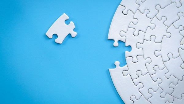White jigsaw pieces on a blue background
