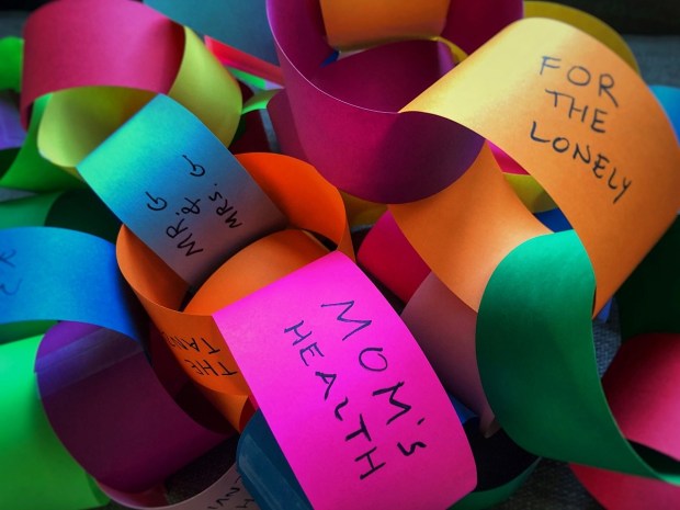 Colorful prayer chain made of construction paper.