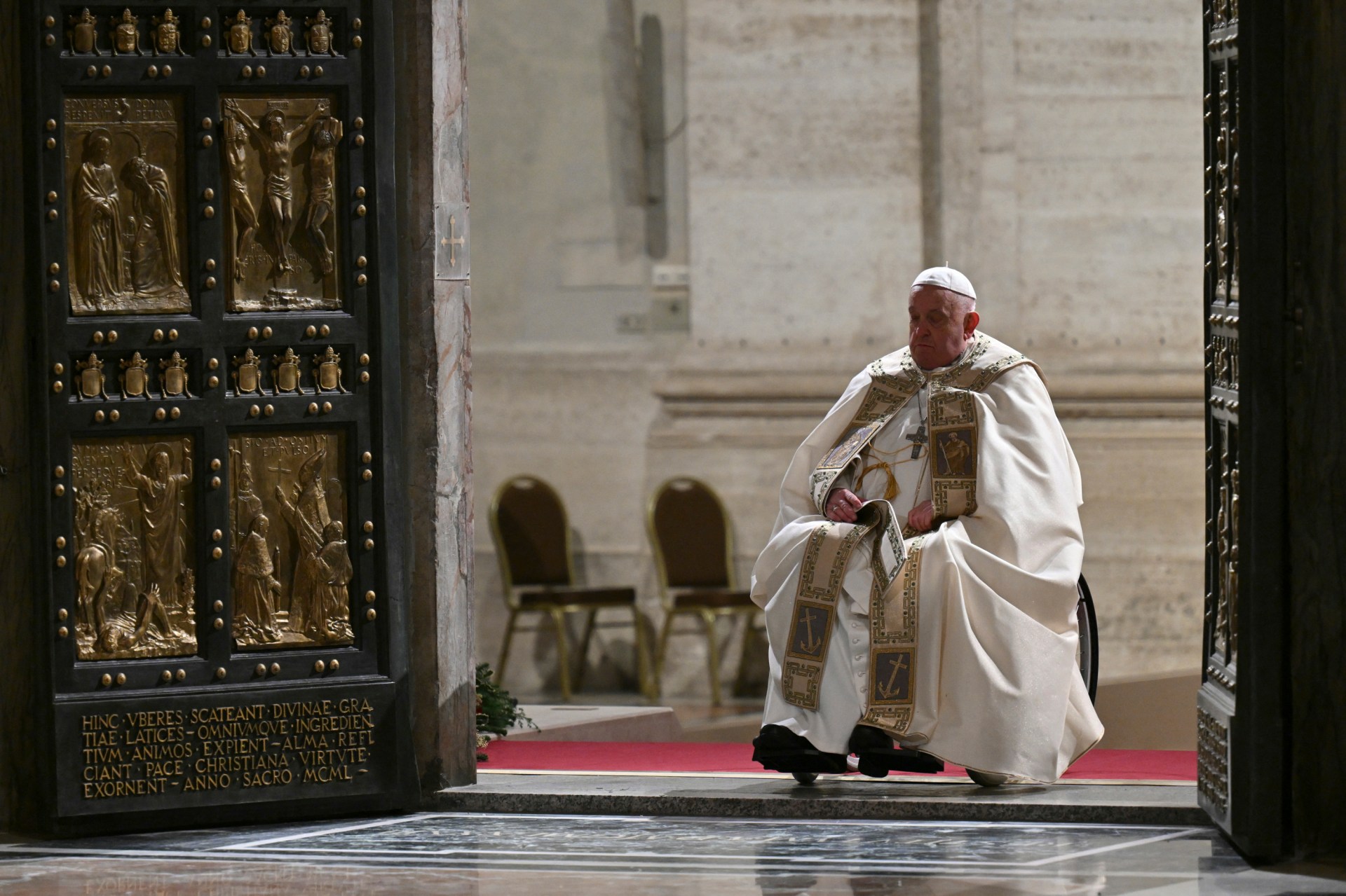 Pope Francis opens the Holy Door of St Peter's Basilica in the Vatican to mark the start of the Catholic Jubilee Year, on December 24, 2024