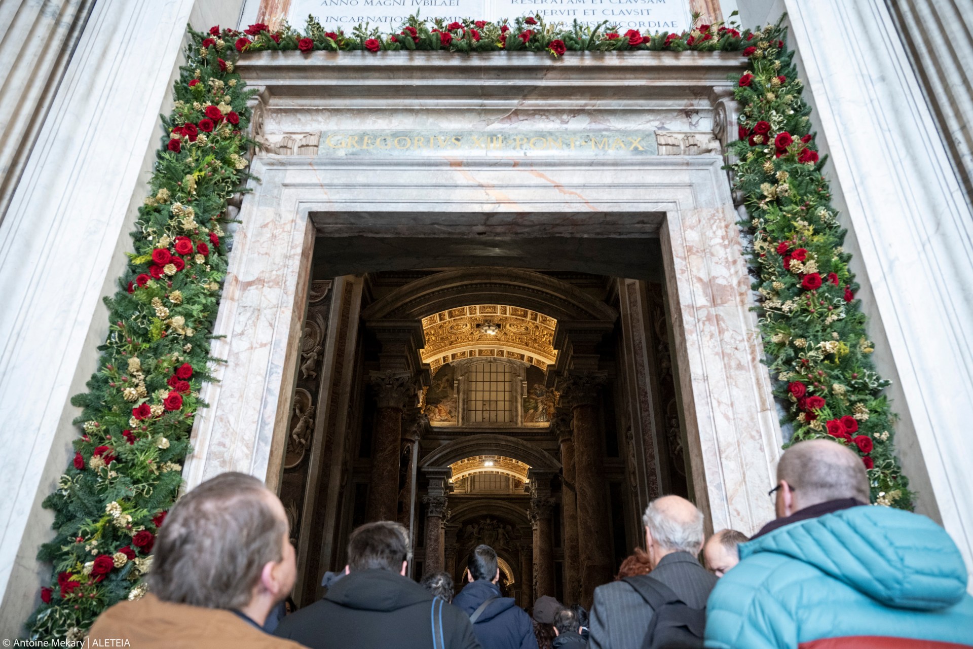 Groups of pilgrims enter St Peter's Basilica through the Holy Door a day after Pope Francis opened it for the start of the Catholic Jubilee Year 2025, in the Vatican on December 25, 2024.